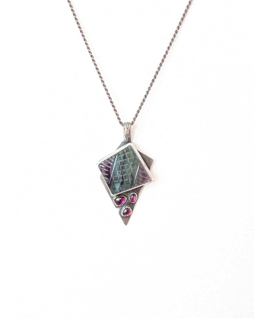 Handcrafted rainbow fluorite and garnet pendant by Rebellenhaus shown on chain (not included)