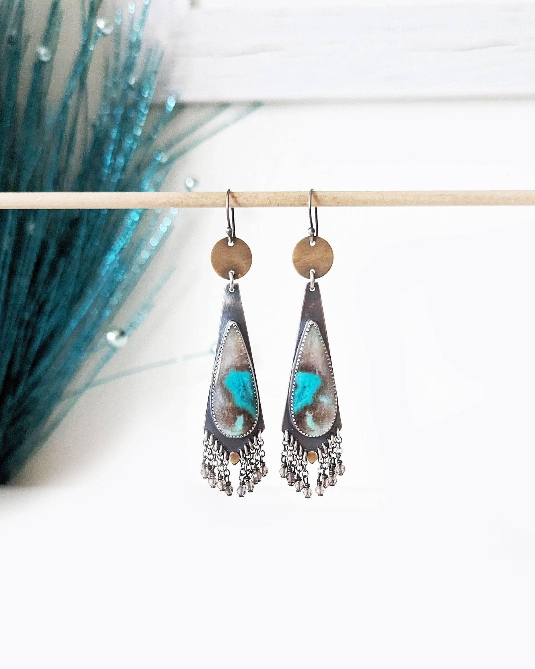 Turquoise colored opalized wood earrings in oxidized sterling silver with smoky quartz fringe