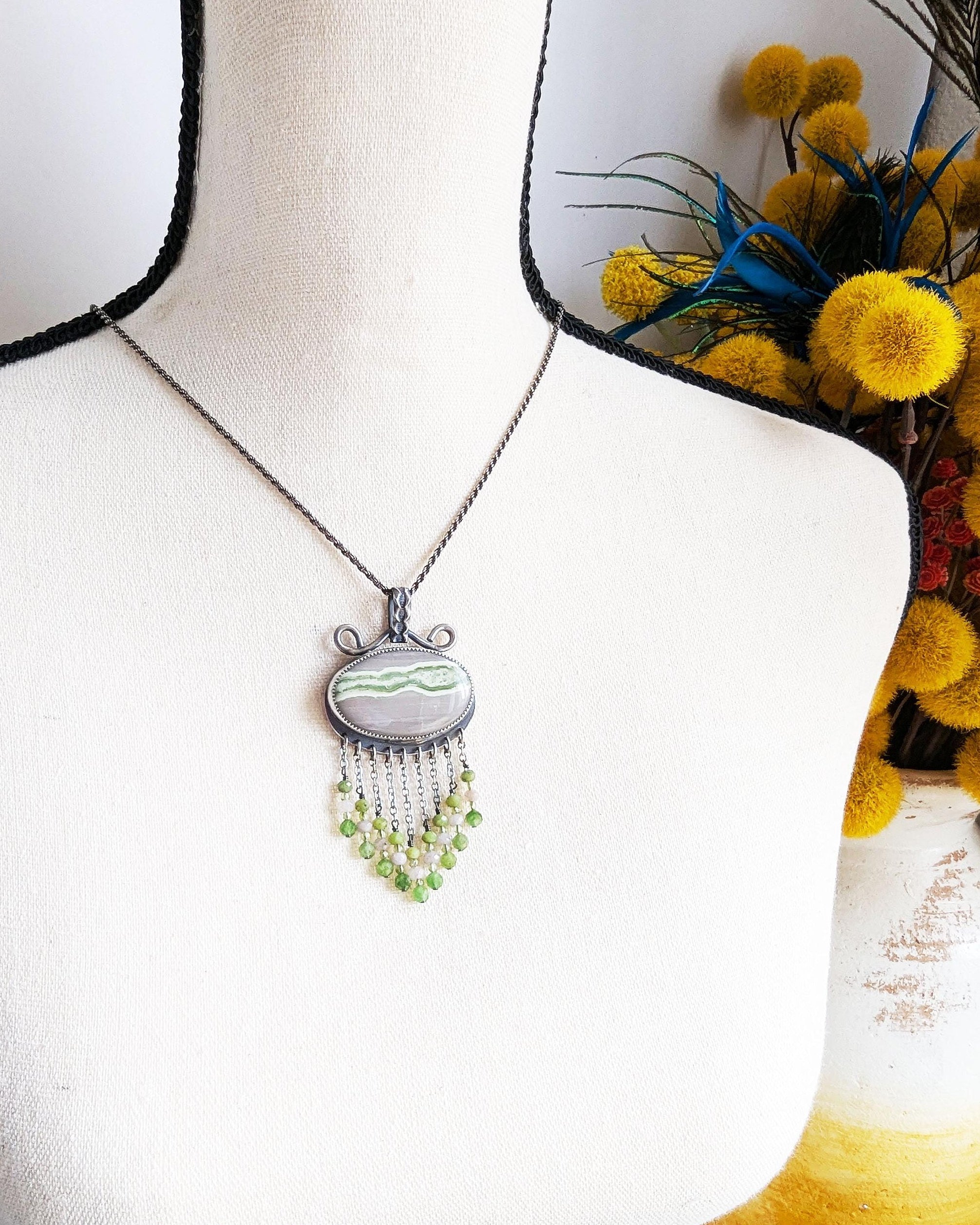 V-shaped gemstone fringe featuring nephrite and peridot