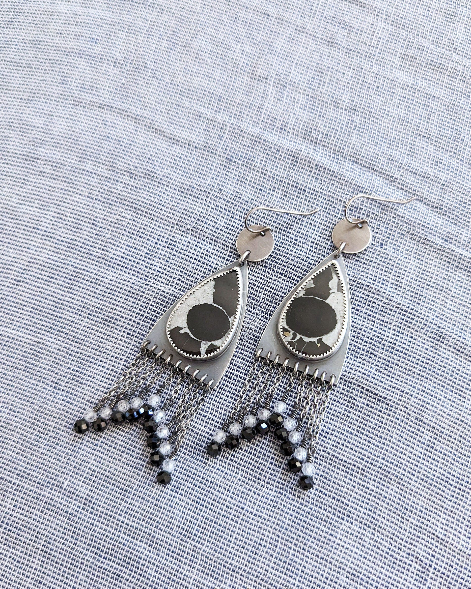 Oxidized sterling silver earrings with septarian fossil, CZ, black spinel, and triangular fringe
