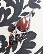 Snakeskin jasper pendant with glittering garnet bead fringe