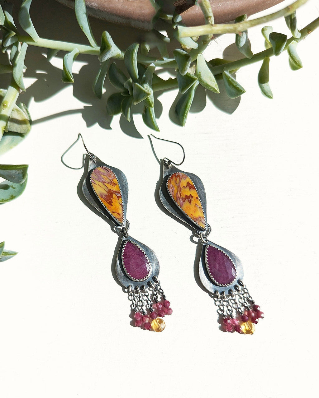 Artisan sterling silver earrings featuring pink sapphire accents