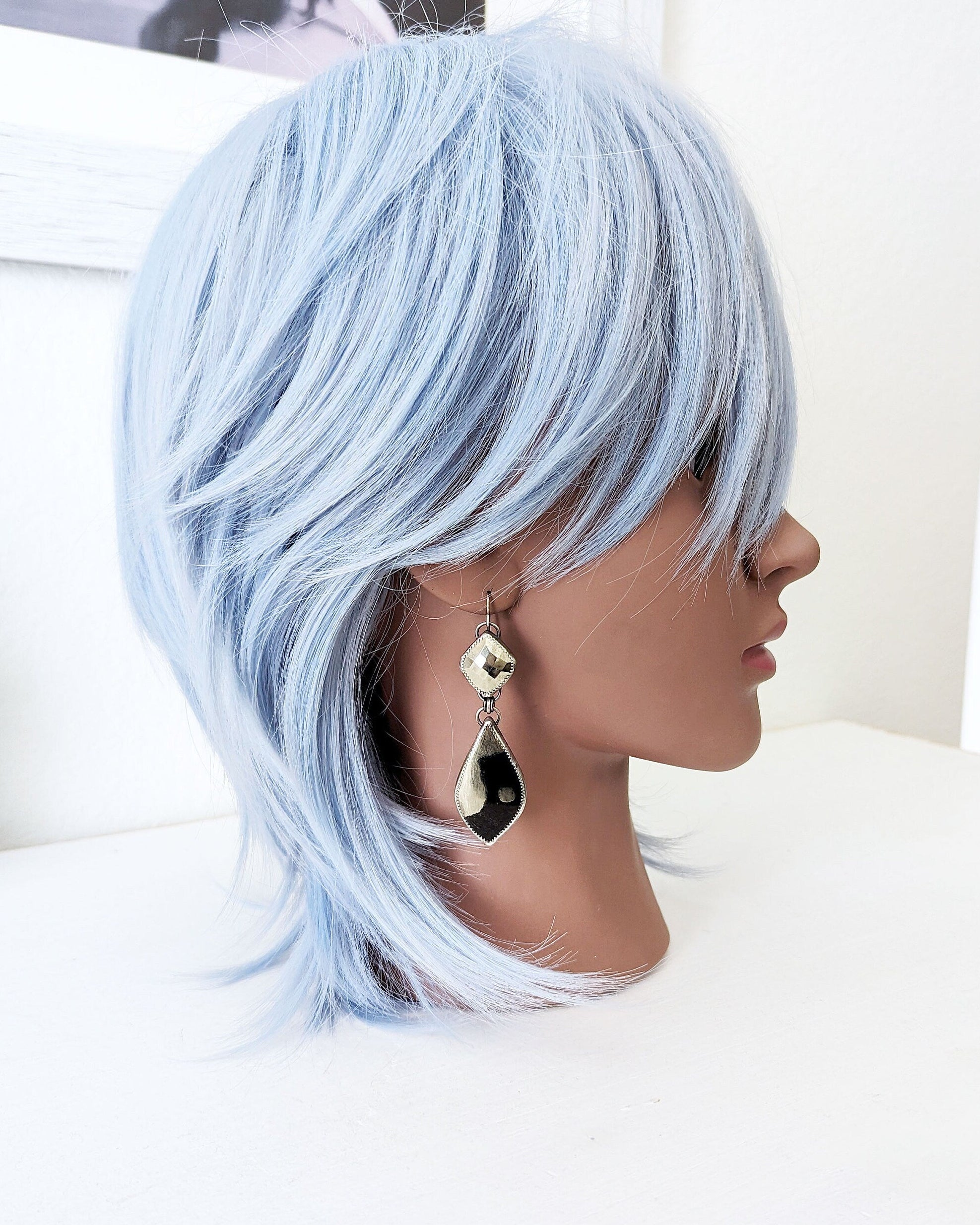 Collector-level two-stone pyrite earrings with dramatic contrast and shimmer on mannequin for scale