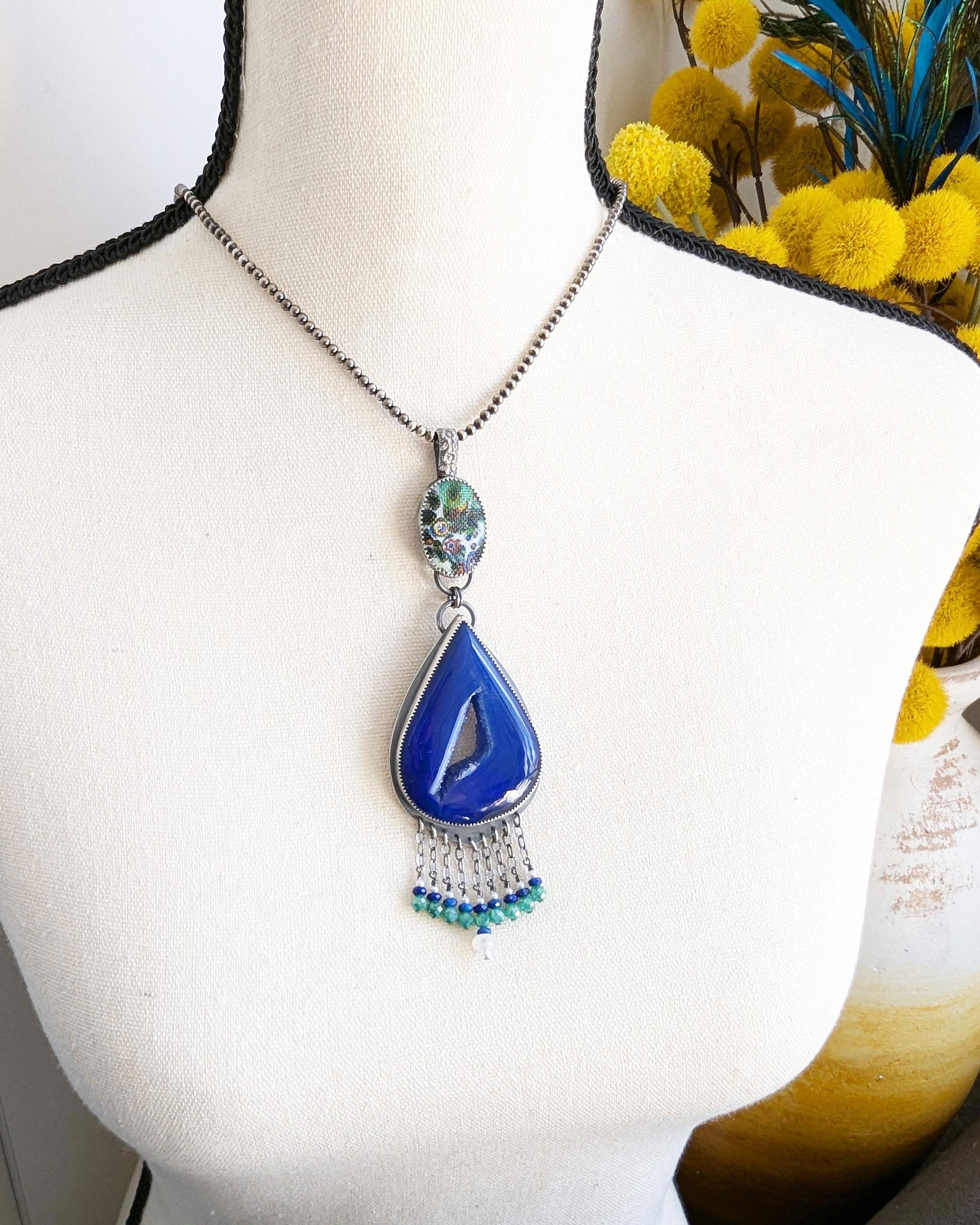 One of a kind blue druzy agate pendant in oxidized sterling silver shown on bust for scale