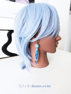 Collector artisan earrings featuring vintage glass and gemstone accents on mannequin for scale