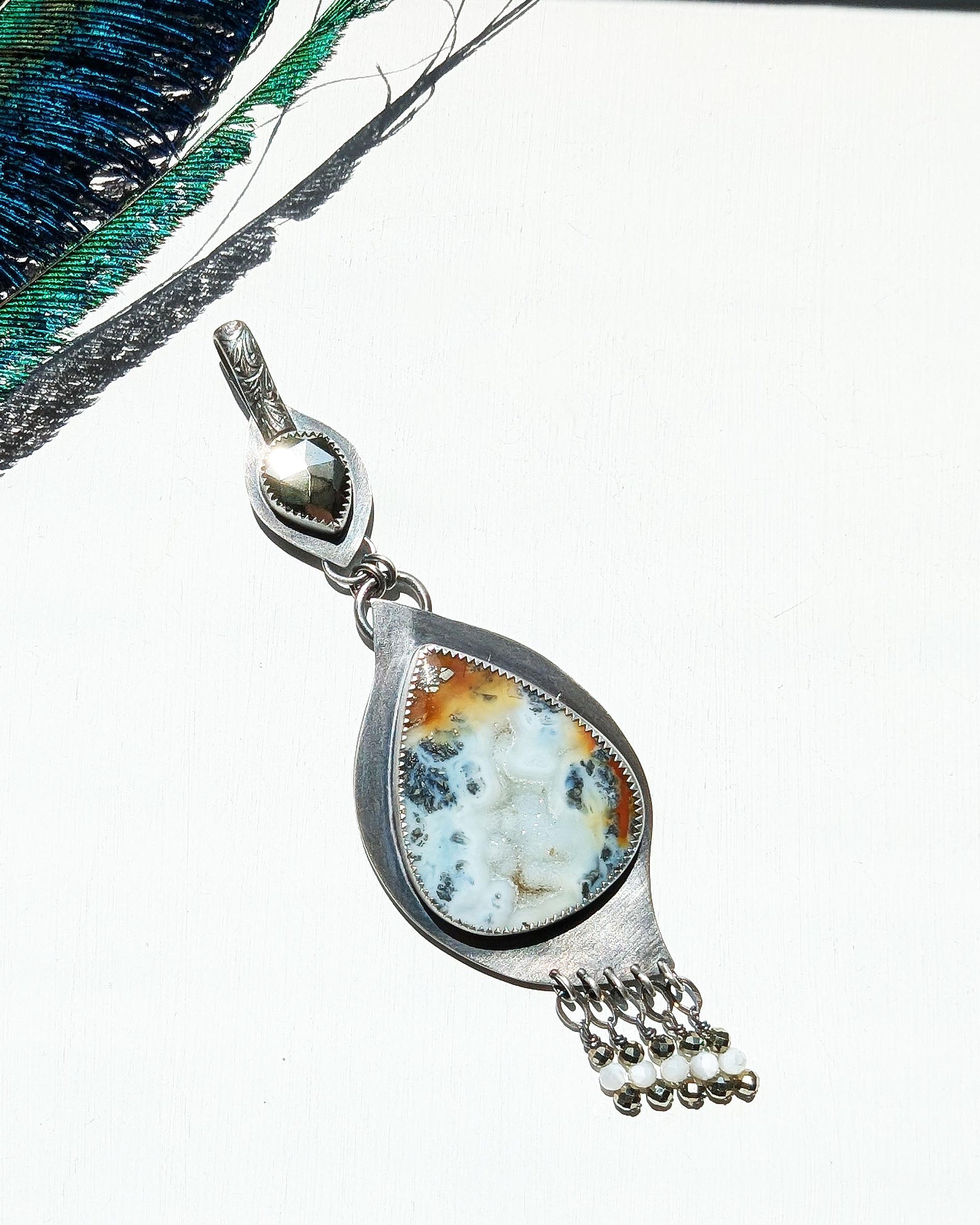 Two-stone artisan pendant with pyrite and mother of pearl fringe
