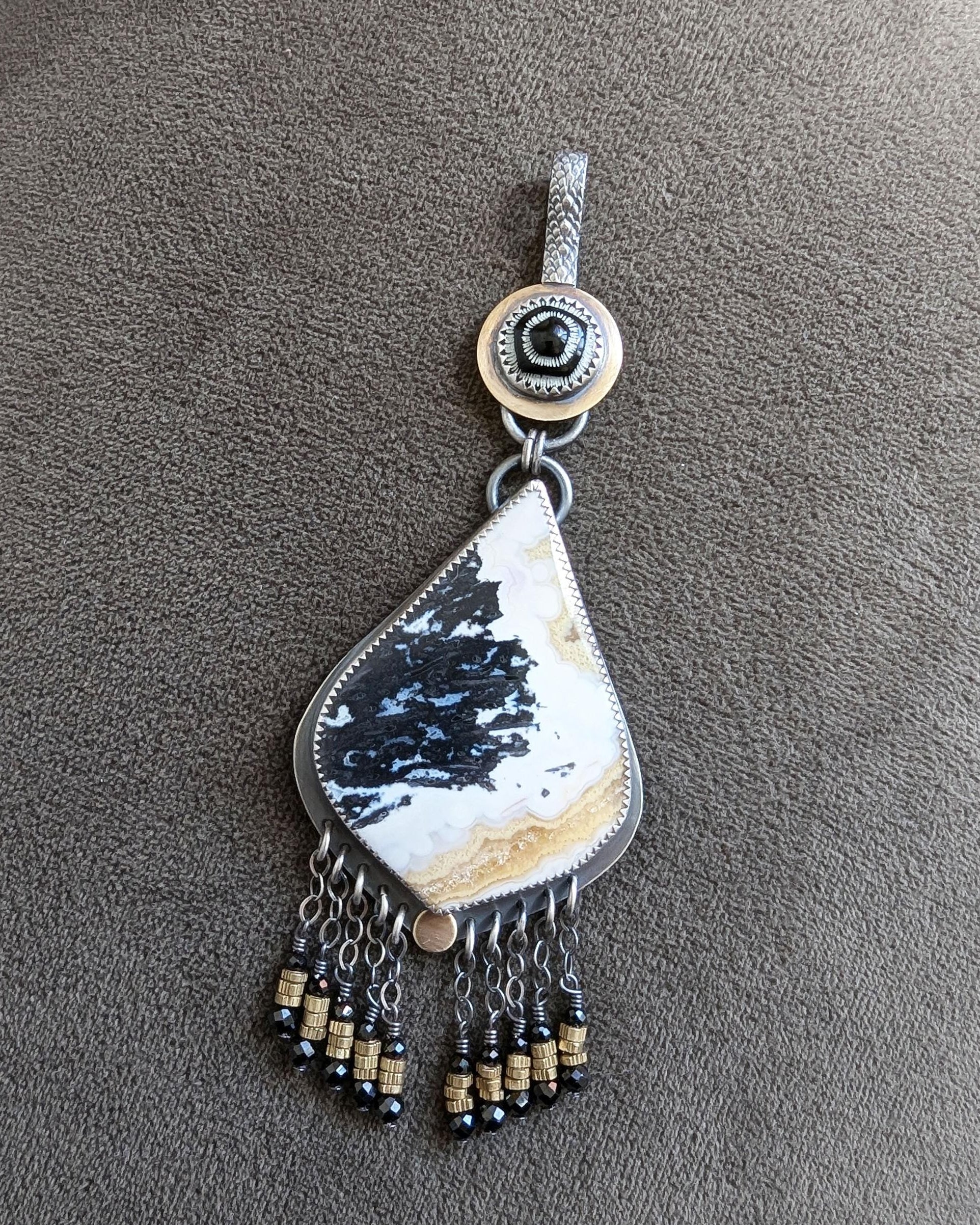 Mixed metal boho pendant with palm root agate and black spinel 