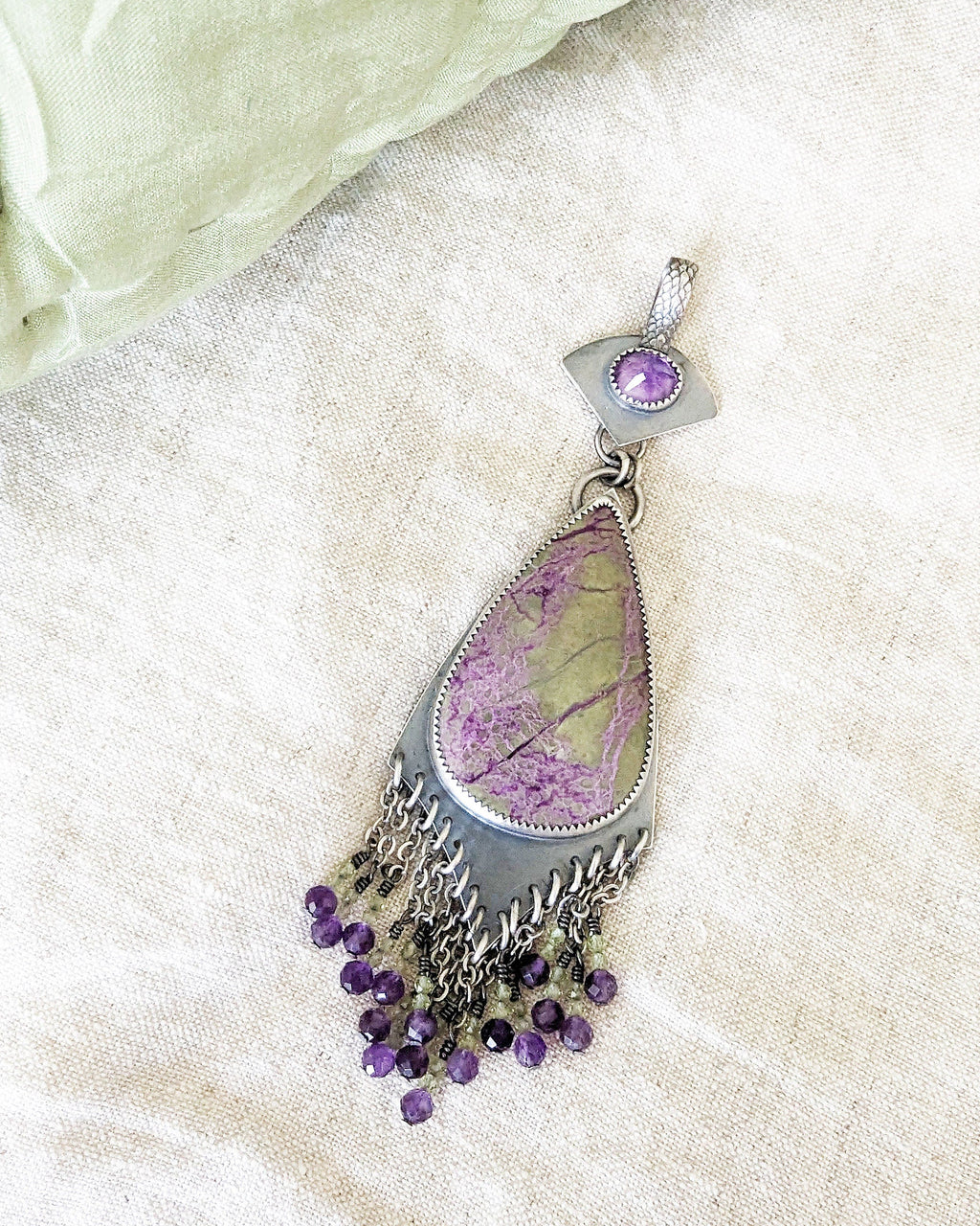 Sterling silver two-stone pendant with colorful gemstone movement