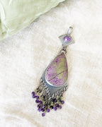 Sterling silver two-stone pendant with colorful gemstone movement