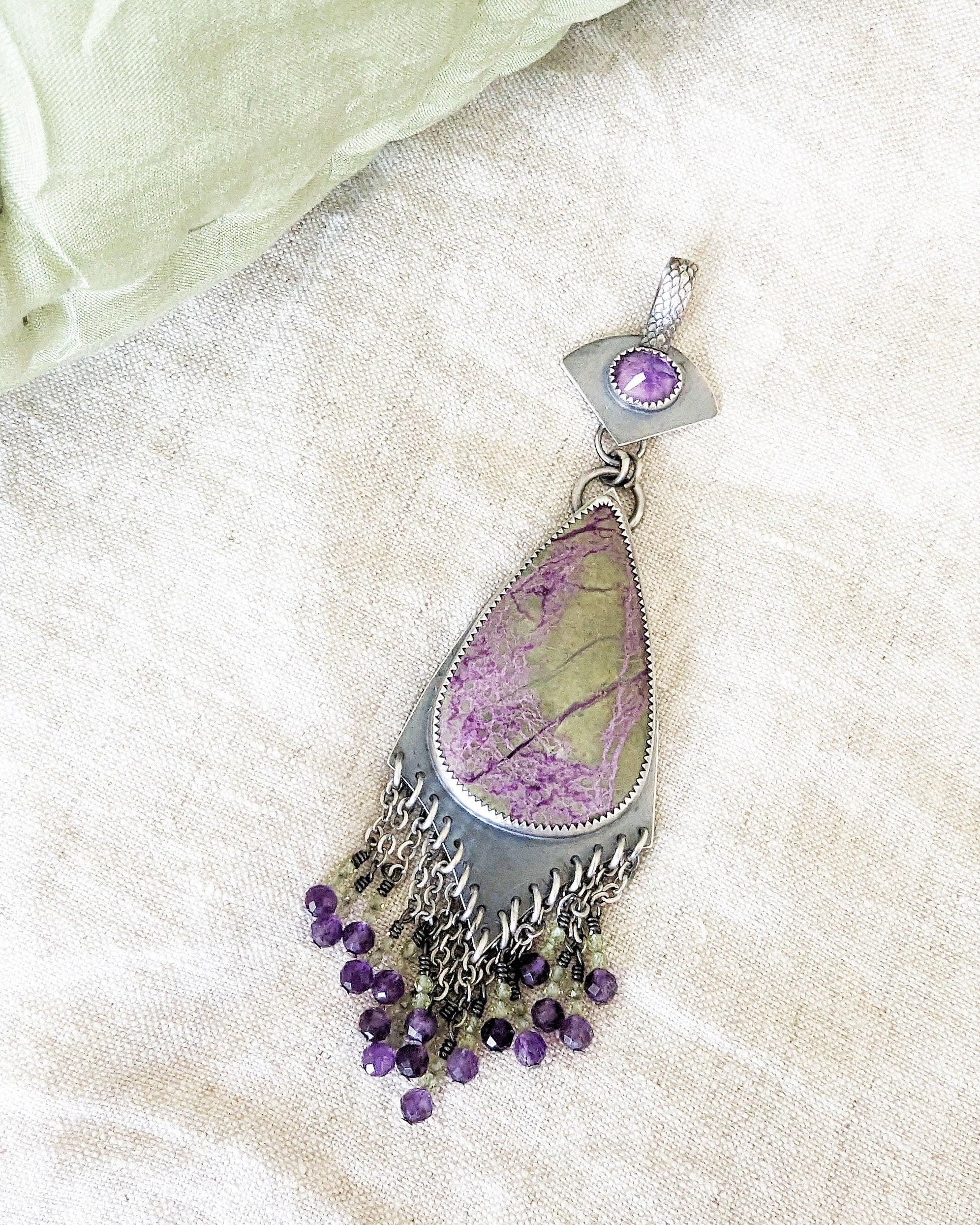 Sterling silver two-stone pendant with colorful gemstone movement