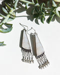 Fossil coral earrings with translucent white snowflake patterns