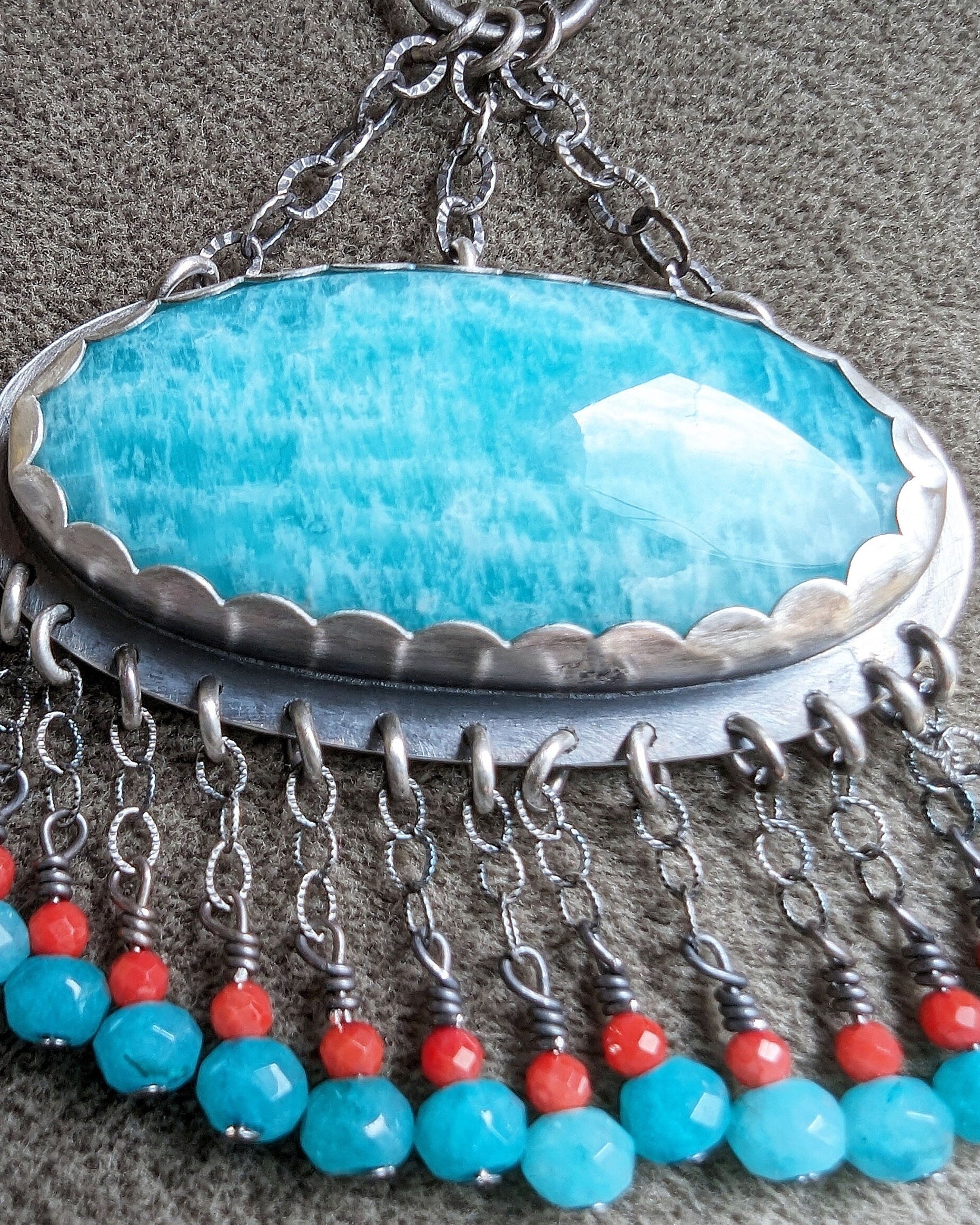 Close up of amazonite stone and beadwork in oval gemstone necklace