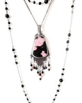 Rhodonite pendant with pink and black pattern in oxidized sterling silver shown on chain with layering necklace (not included)