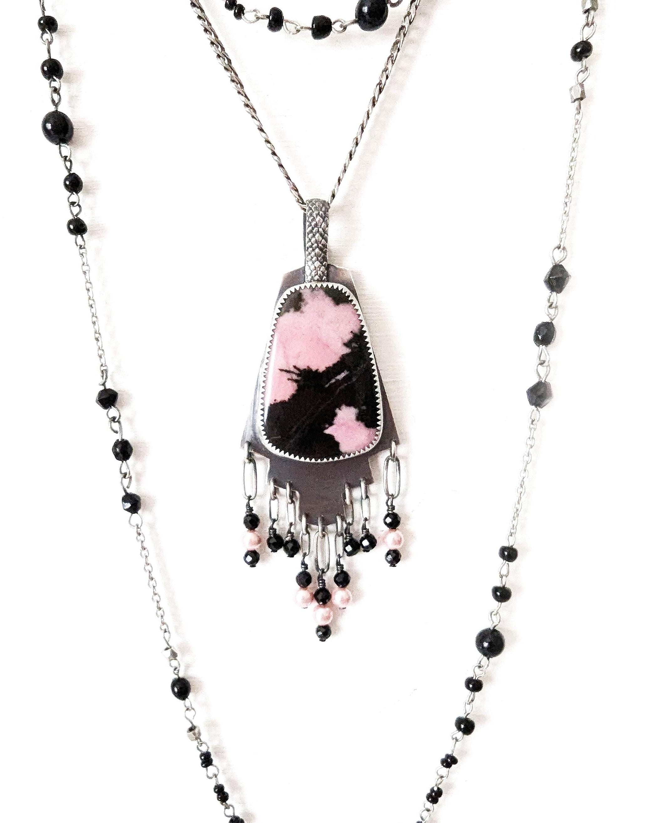 Rhodonite pendant with pink and black pattern in oxidized sterling silver shown on chain with layering necklace (not included)