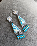 Collector gemstone earrings with balanced fringe movement