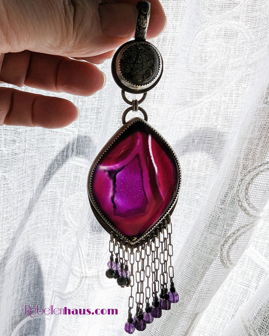 Backlit druzy agate center and black tourmaline-amethyst fringe