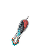 Close-up of Sonoran jasper showing red and turquoise fire-like natural patterns
