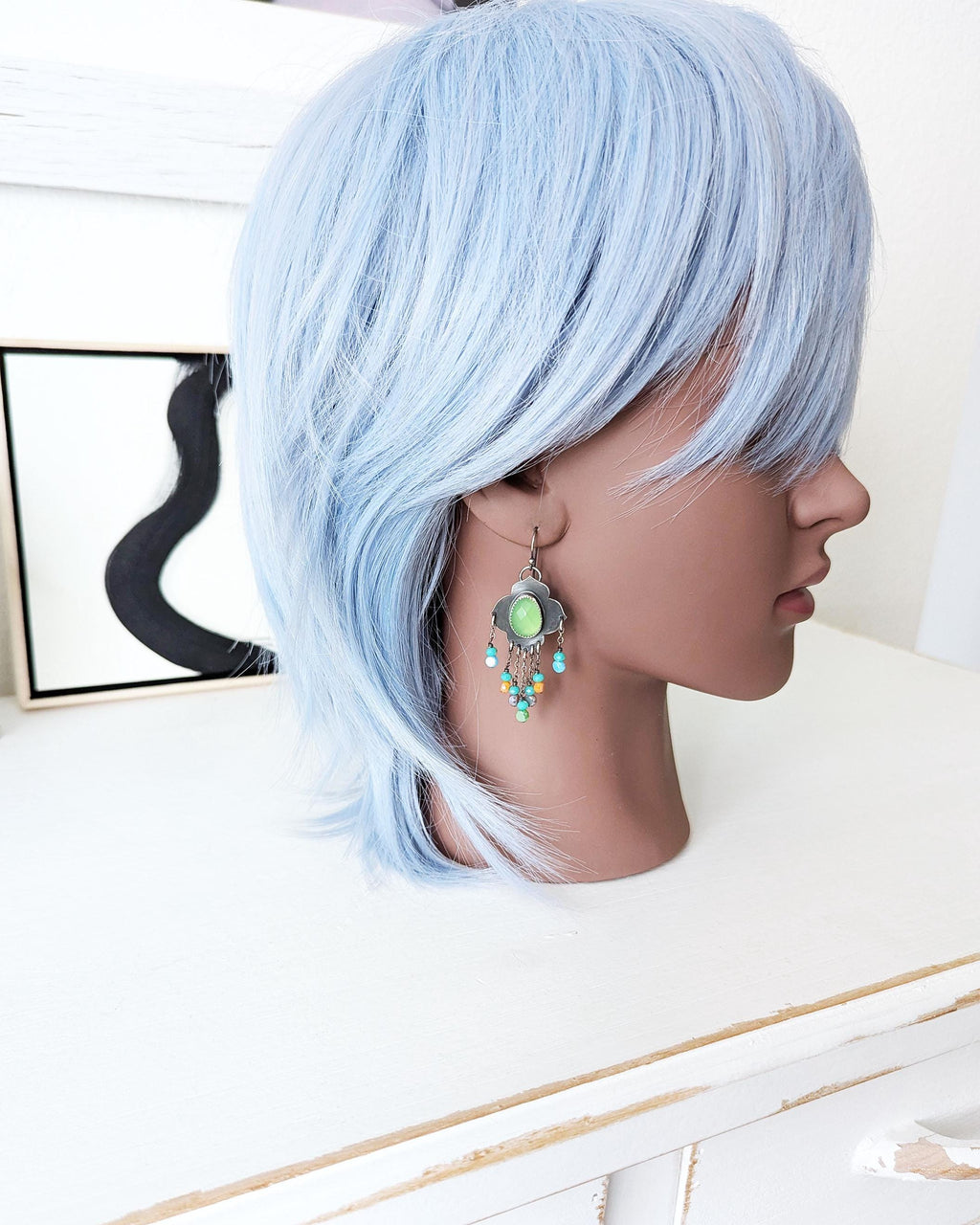 Bold neon-inspired statement earrings with playful shimmer
