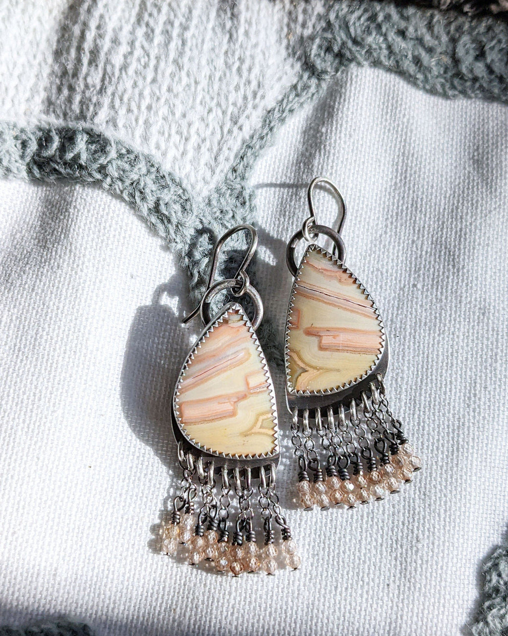 Artisan handmade oxidized silver earrings with warm peach and cream agate
