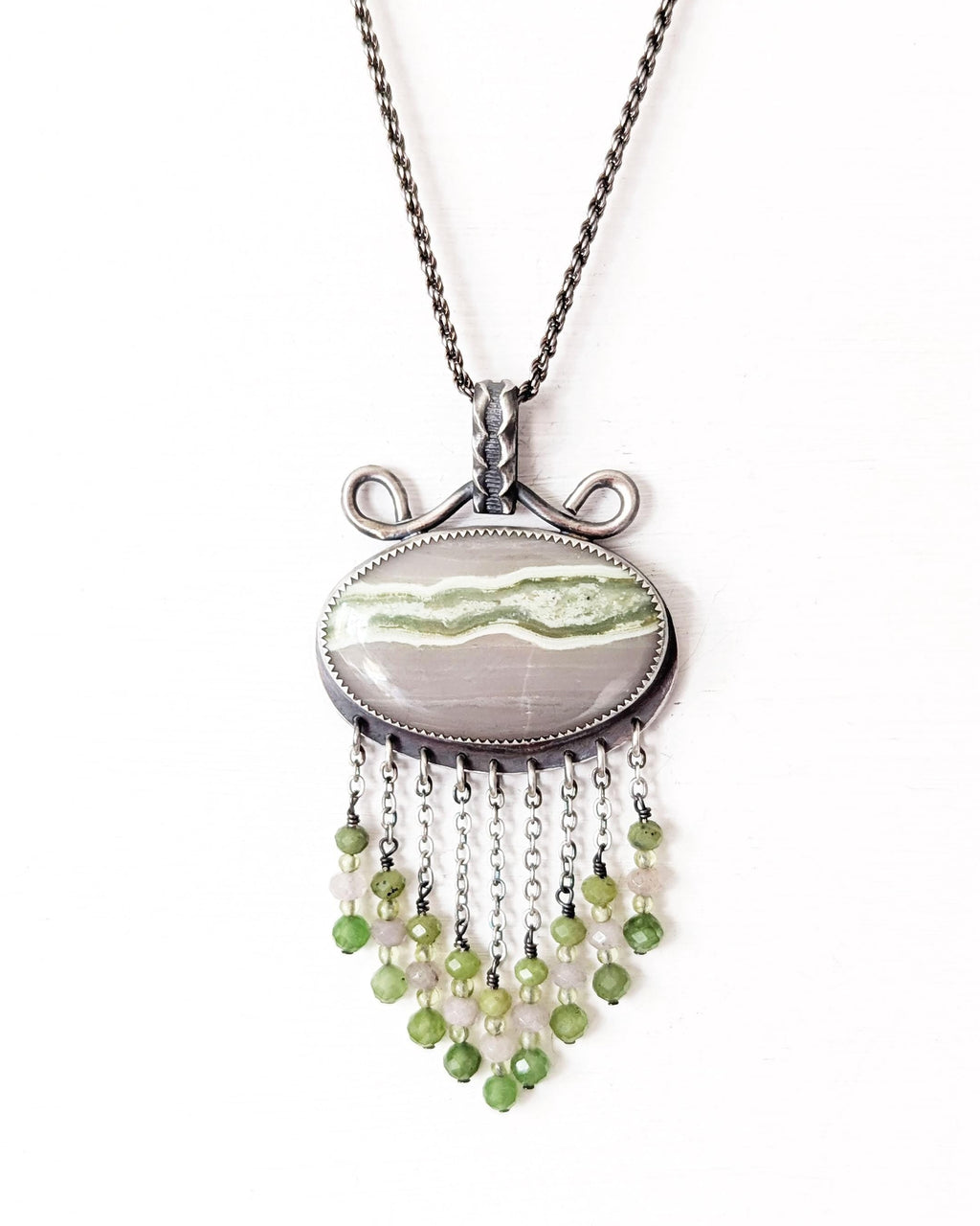 Horizontal oval serpentine pendant with lime green vein on chain (not included)