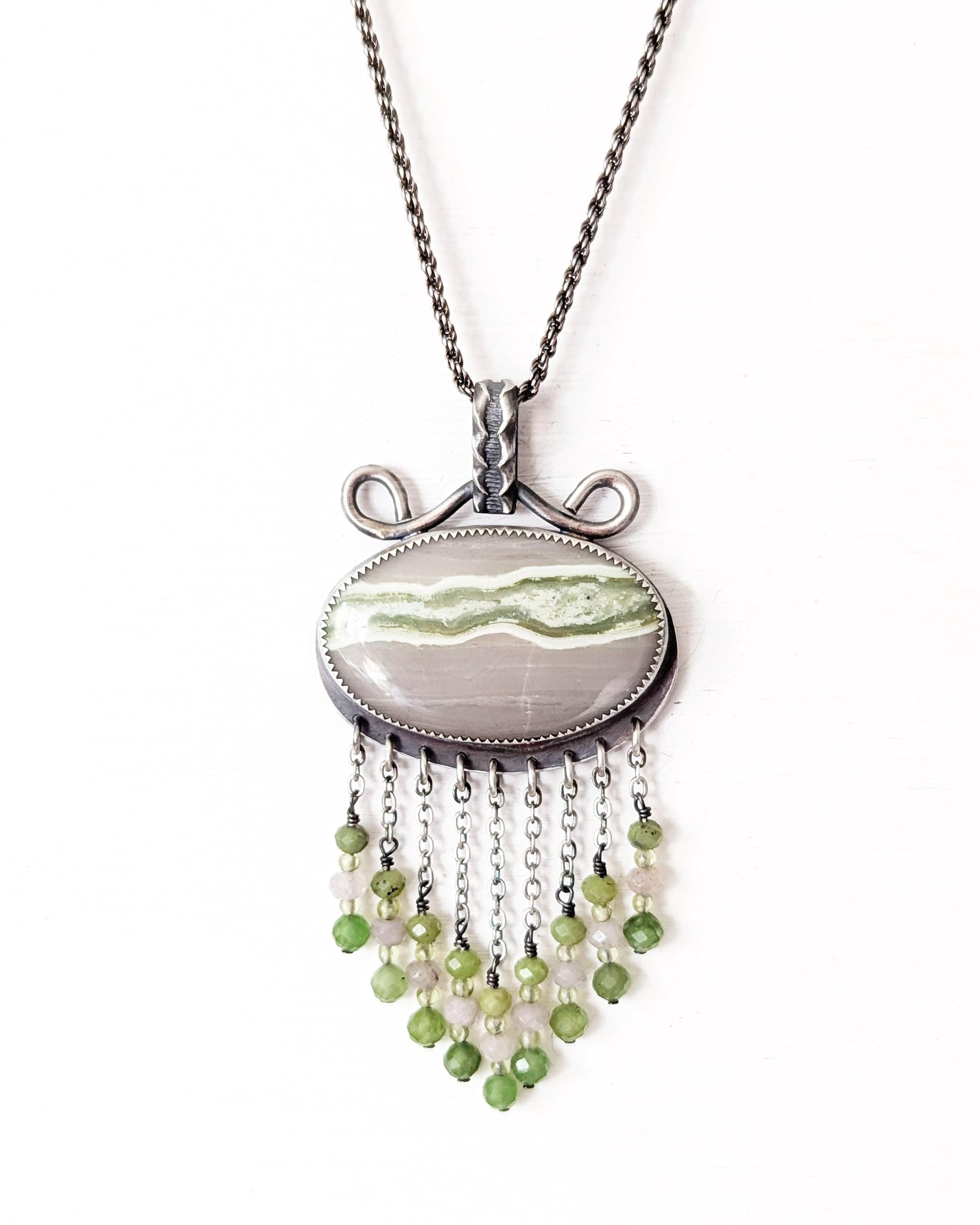 Horizontal oval serpentine pendant with lime green vein on chain (not included)
