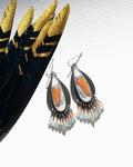 Opalized wood earrings with mustard and mauve abstract patterns