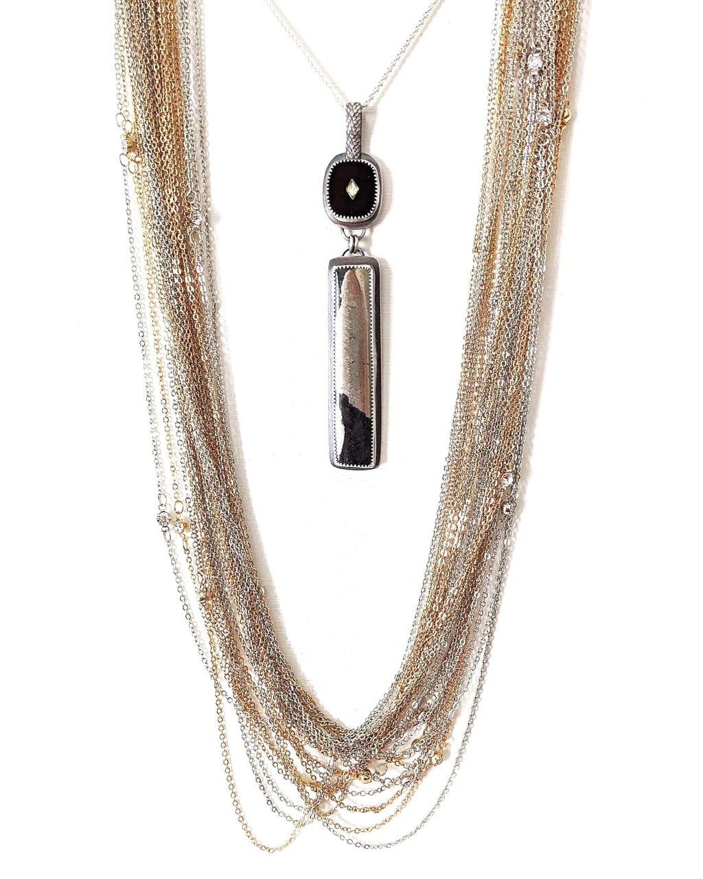 Vintage rhinestone inlay cabochon above raw Apache pyrite shown on chain with layer necklace (not included)