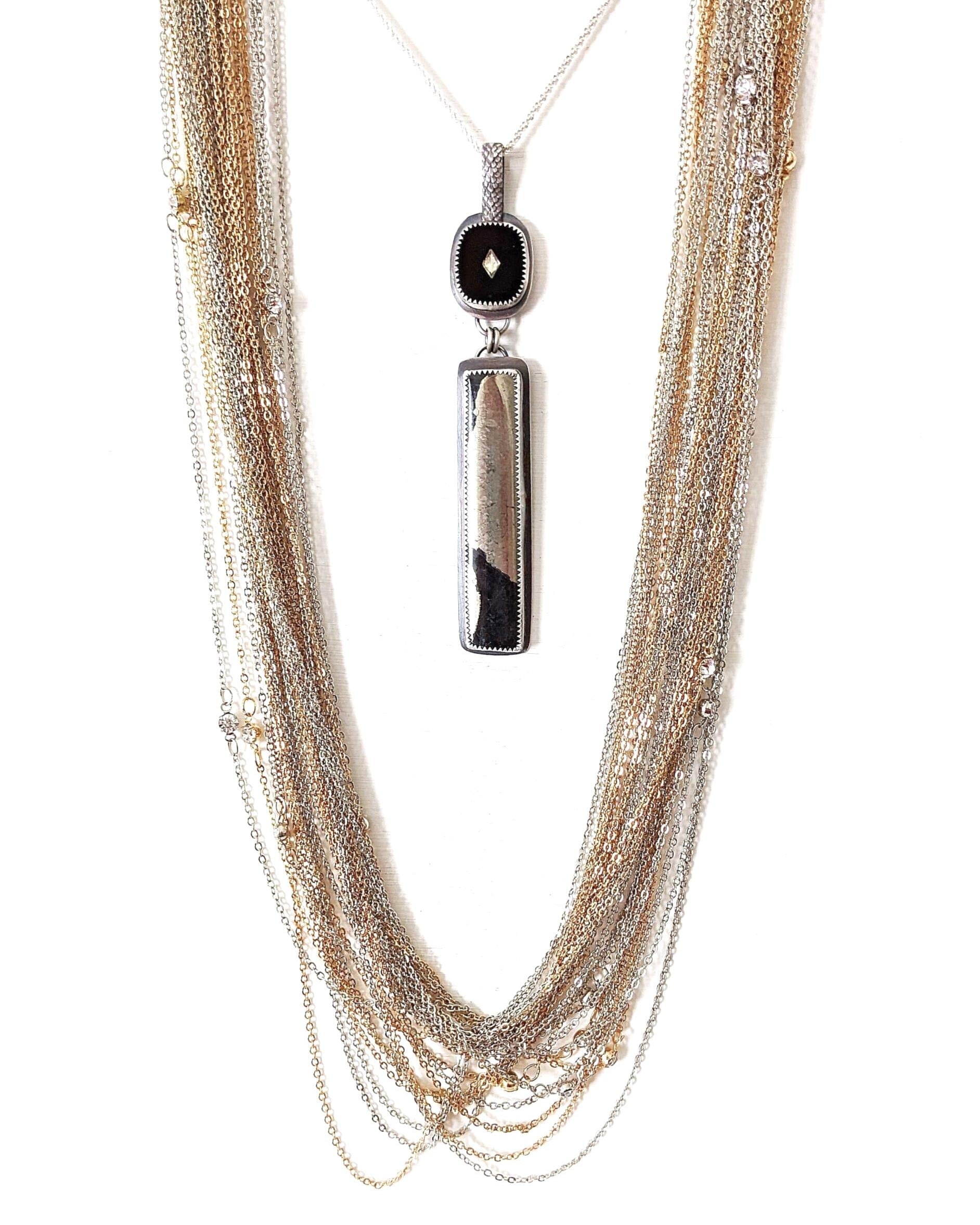 Vintage rhinestone inlay cabochon above raw Apache pyrite shown on chain with layer necklace (not included)