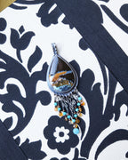 Teardrop opalized wood centerpiece with coastal-inspired color palette