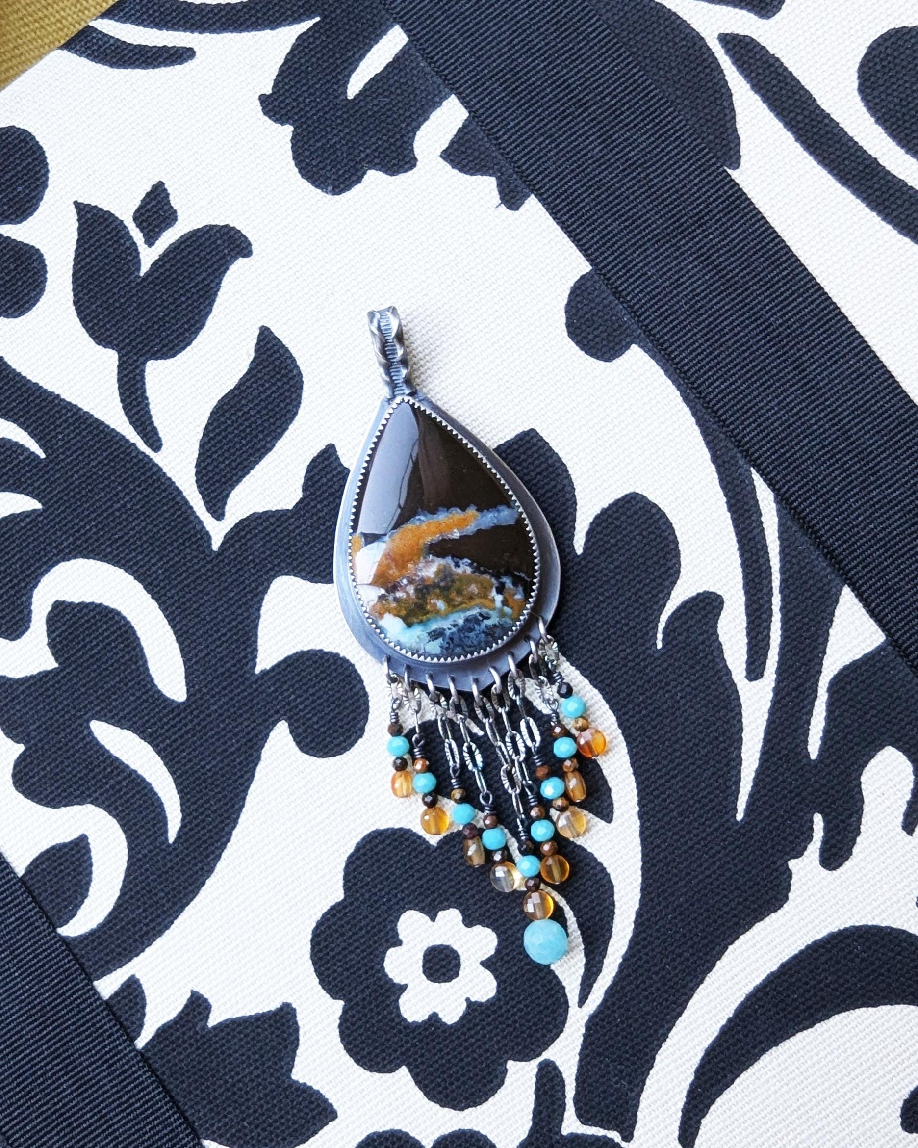 Teardrop opalized wood centerpiece with coastal-inspired color palette