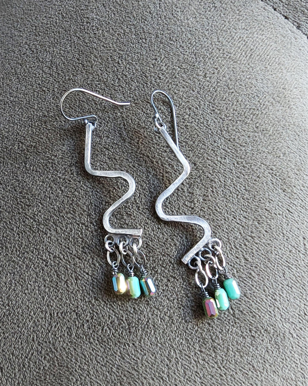 Oxidized silver dangle earrings with vibrant iridescent sparkle