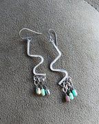 Oxidized silver dangle earrings with vibrant iridescent sparkle
