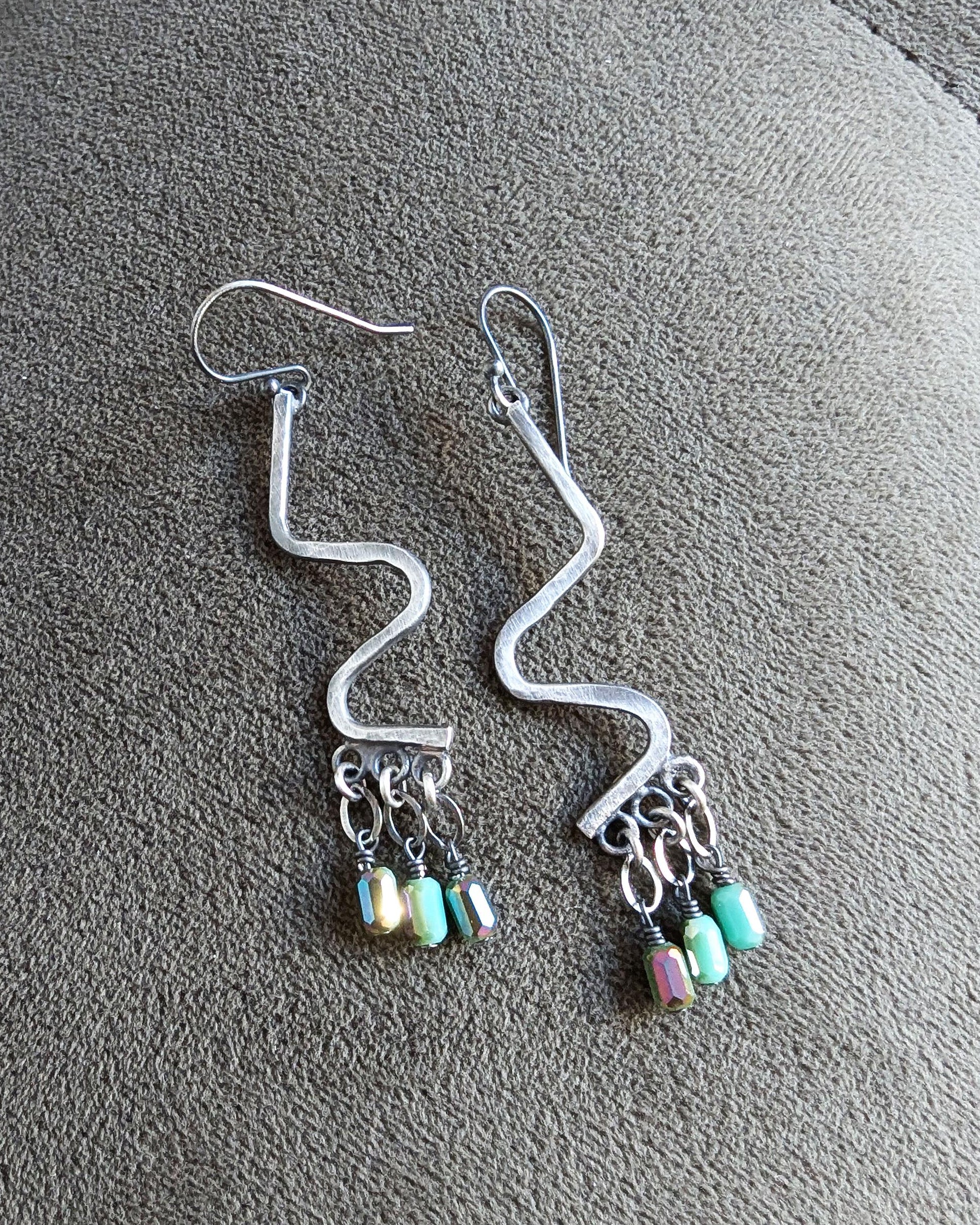 Oxidized silver dangle earrings with vibrant iridescent sparkle