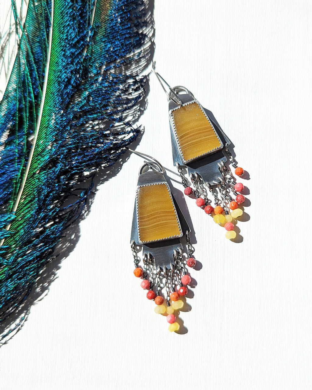 Golden calcite earrings with vibrant coral and yellow jade fringe