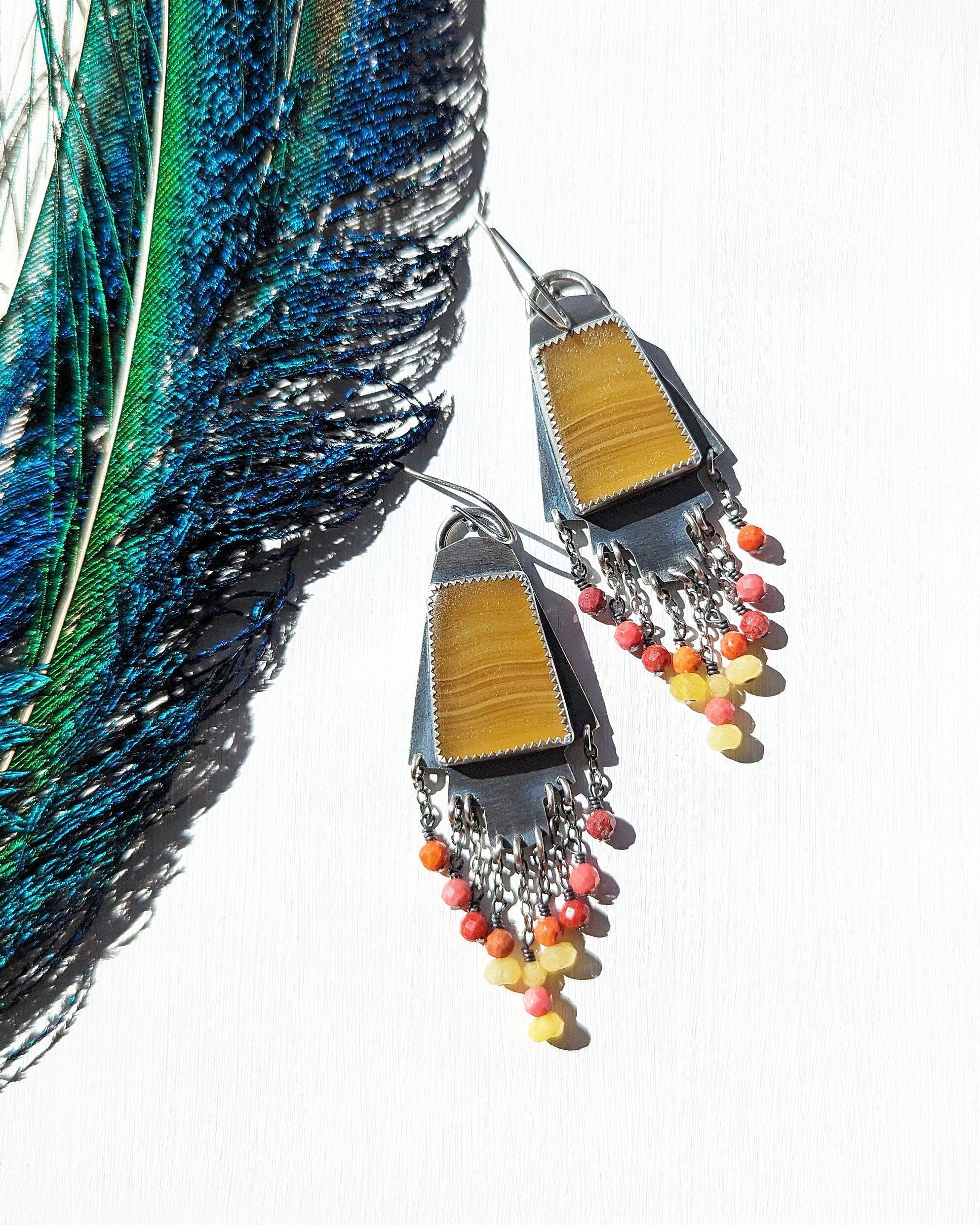Golden calcite earrings with vibrant coral and yellow jade fringe