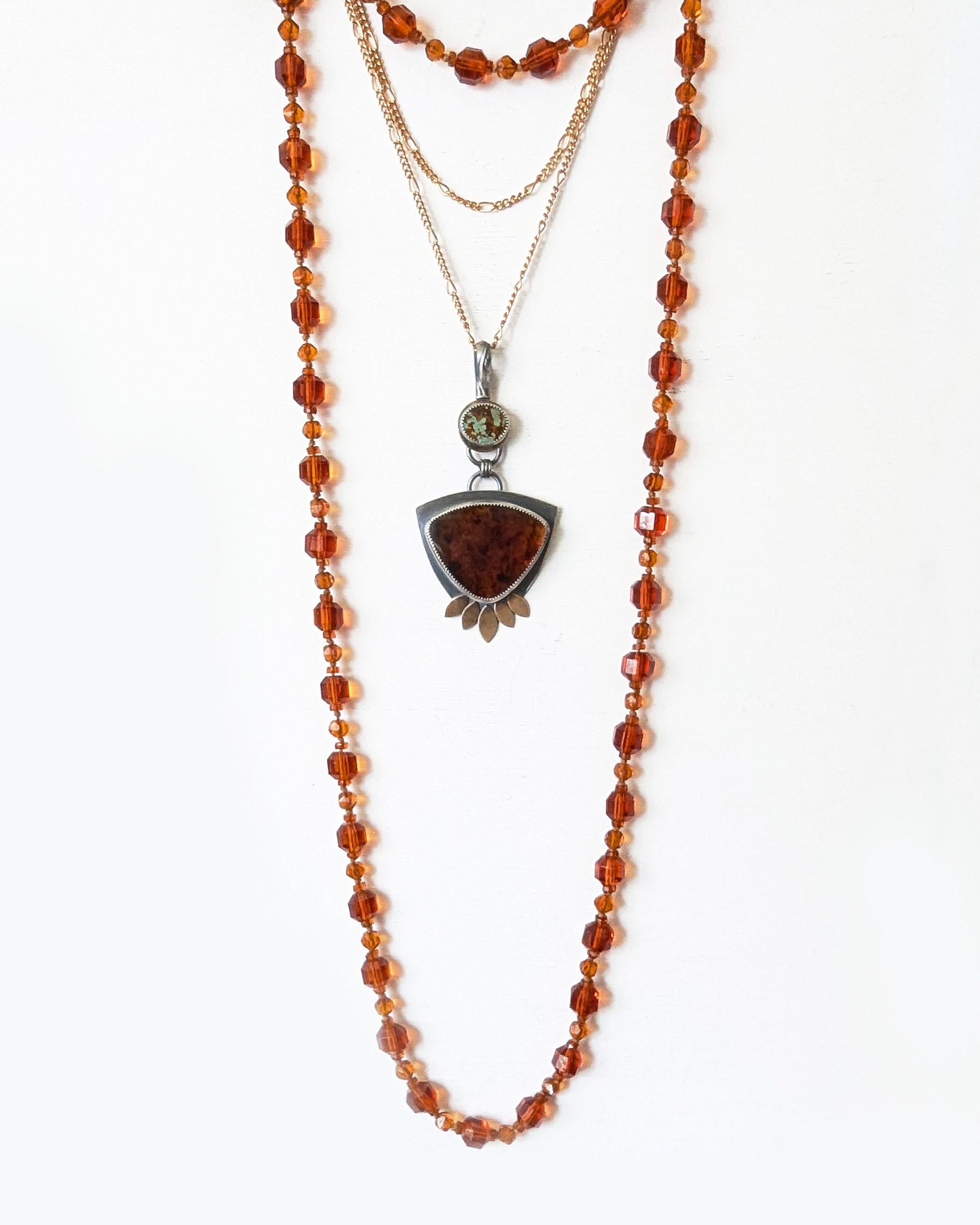 Mixed metal statement pendant with triangular blue amber and green turquoise shown on chain (not included)