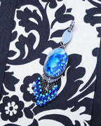 Oxidized sterling silver pendant with marquis bail and ocean-blue stone