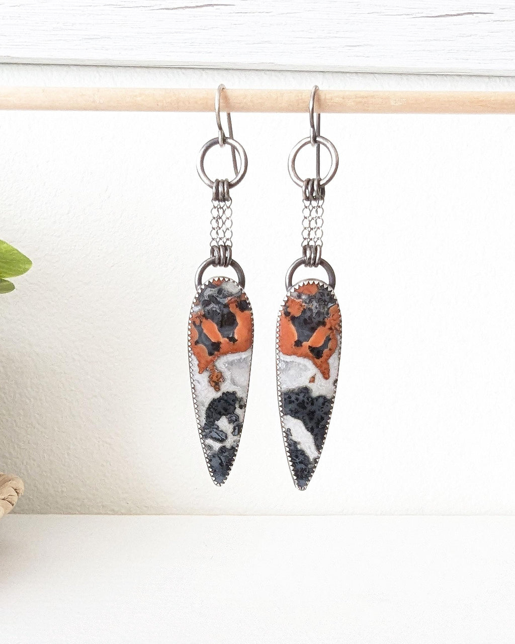 Reddish orange black and white jasper statement earrings with chain fringe