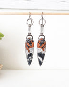 Reddish orange black and white jasper statement earrings with chain fringe