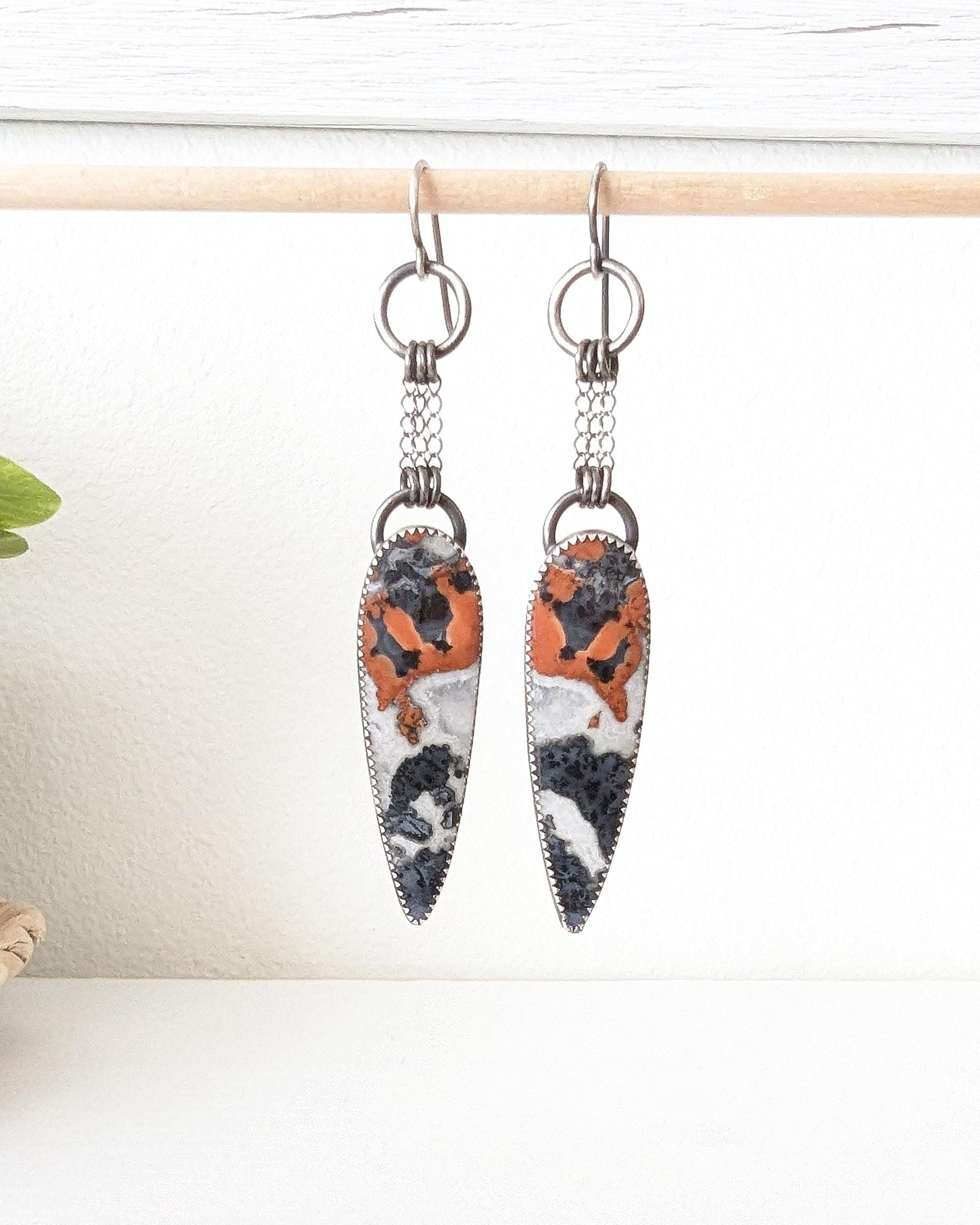 Reddish orange black and white jasper statement earrings with chain fringe