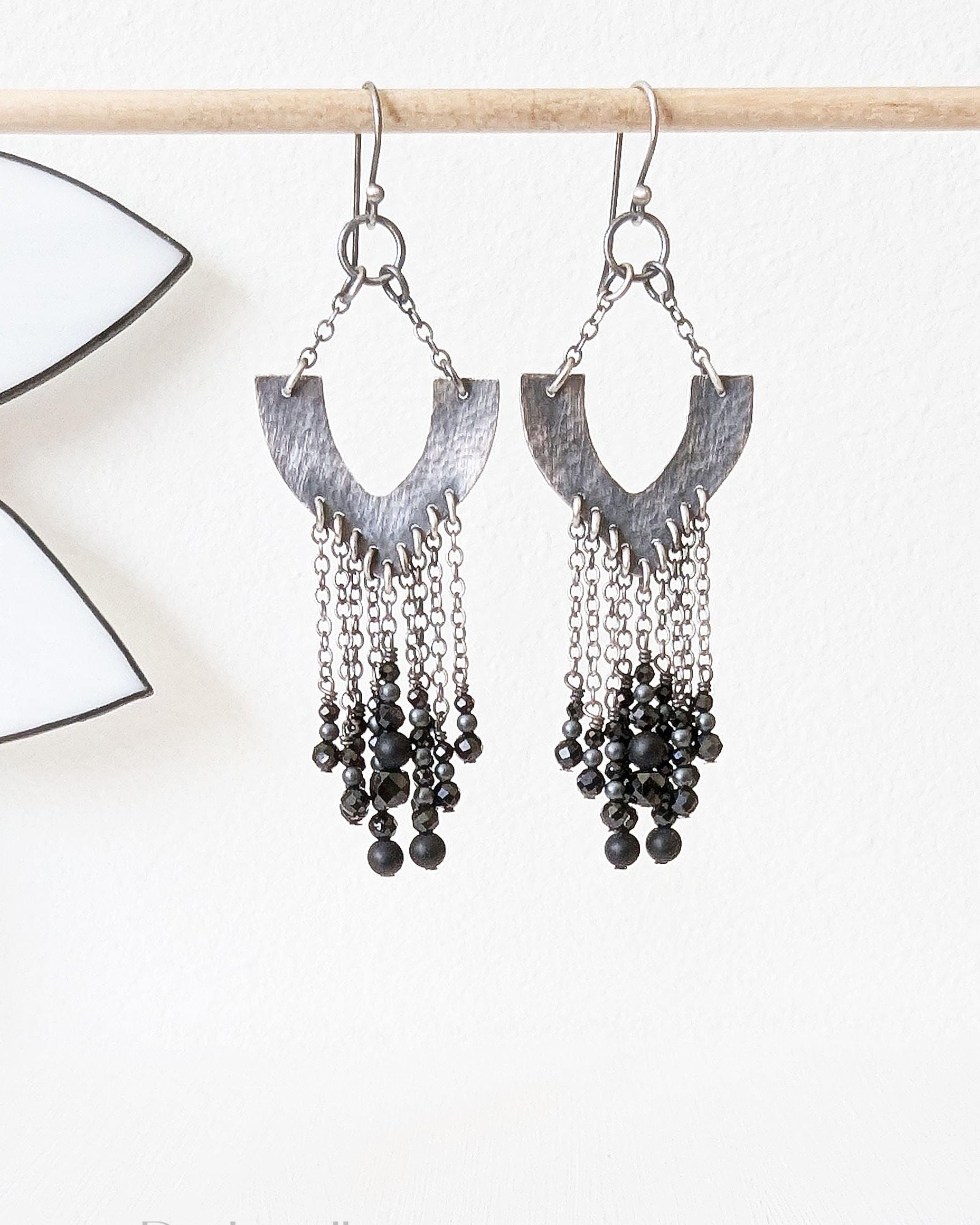 Oxidized silver horseshoe earrings with black glass and spinel chain fringe
