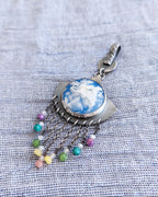 Fan-shaped silver pendant with plume agate and multicolor bead drops