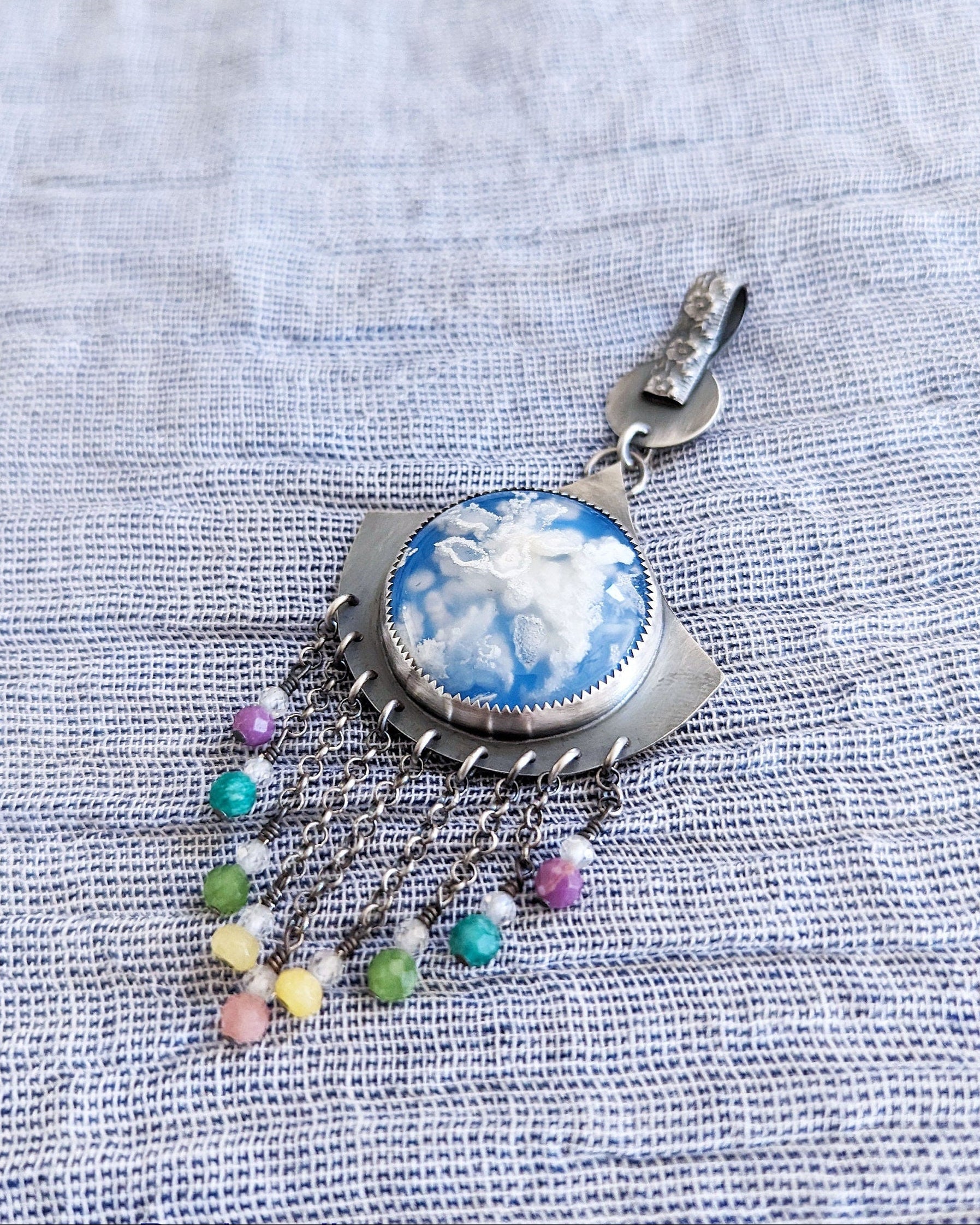 Fan-shaped silver pendant with plume agate and multicolor bead drops