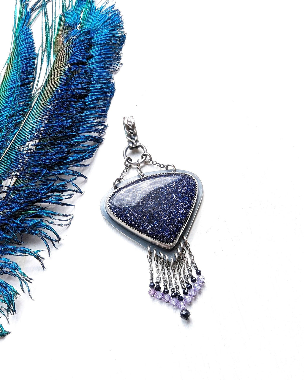 Navy blue goldstone statement pendant with lavender cubic zirconia accents