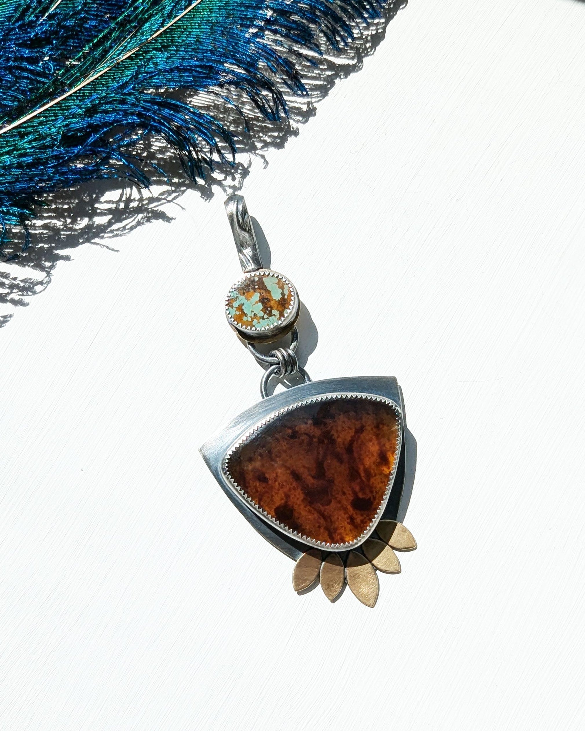 Close up of Indonesian blue amber shifting from brown to golden hues