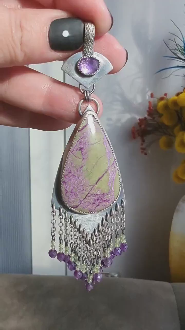 Video of collector gemstone pendant featuring stichtite, amethyst, and peridot