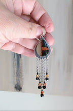 Video of edgy boho earrings with carnelian and black spinel accents by Rebellenhaus