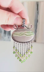 Video of Collector gemstone necklace capturing moody spring palette