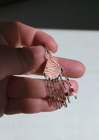 Video of boho statement earrings with warm copper and cool silver contrast by Rebellenhaus