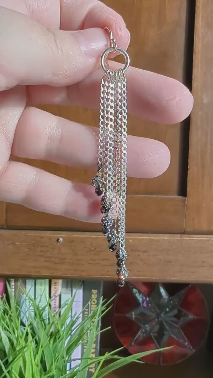 Video of bold disco-inspired sterling silver earrings with dramatic sparkle